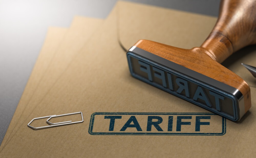 Wibest Broker- Trade Agreement: A stamp of tariff with a document indicating they are about Tariff with a paper clip.