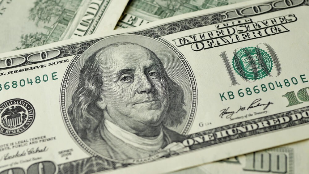 100 Dollars bill and portrait Benjamin Franklin on USA money banknote.