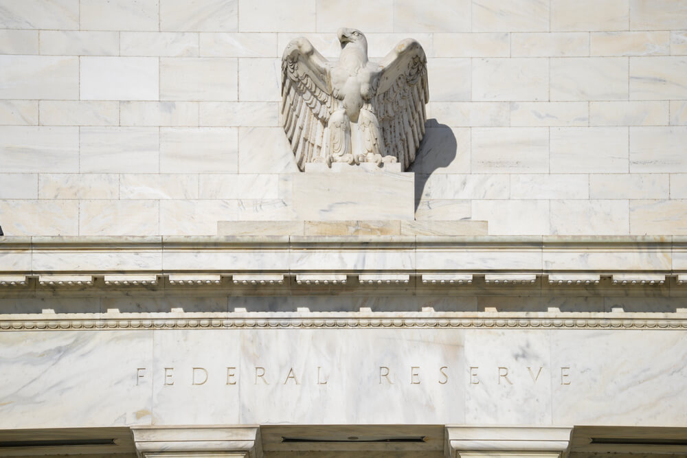 Federal Reserve building closeup to an eagle statue.