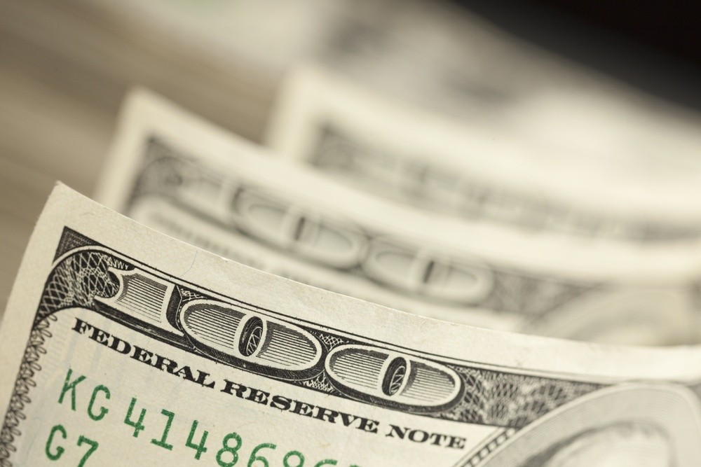 Wibest – fx market: A close up of a US dollar bill.